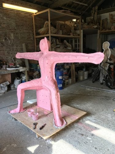 Moulding Speak to us of Giving Moulding Speak to us of Giving. The model is encased in pink silicone to form the mould for casting the bronze sculpture.