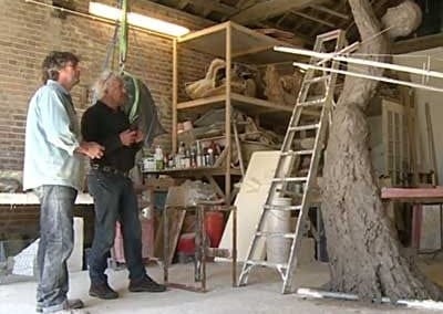 Neil and enlarger, Richard Clarke, looking at the newly enlarged version of Speak to us of Freedom in clay at just under 3.0m